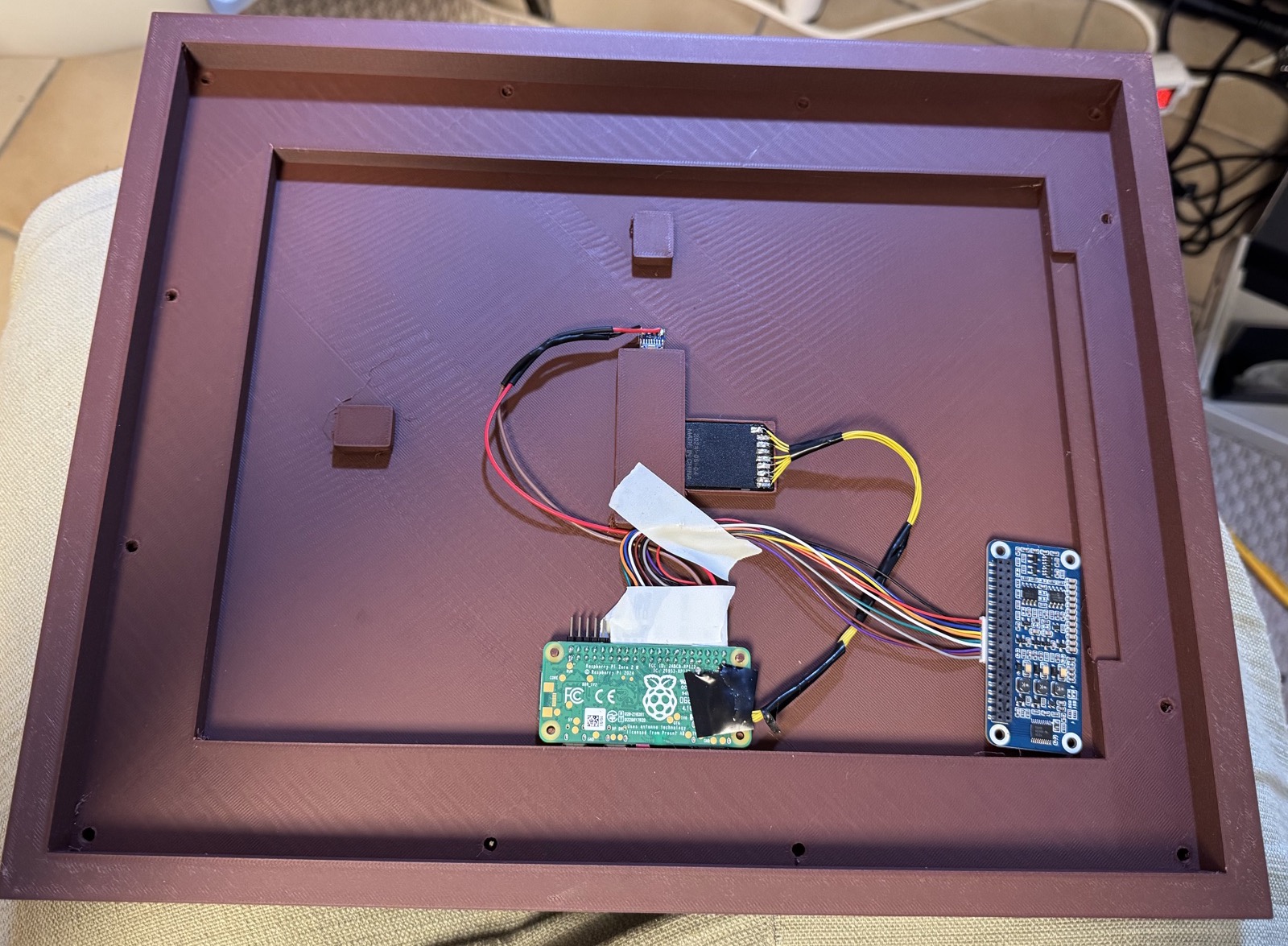 The back of the 13.3 inch frame: Raspberry Pi Zero, Waveshare e-paper HAT and a soldered SD card extension